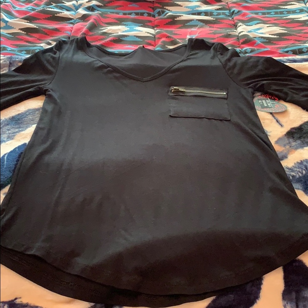 Black long sleeve shirt with zipper pocket.
